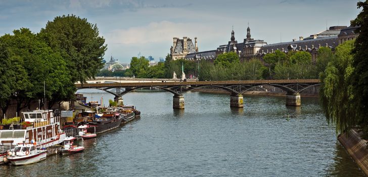 PARIS, FRANCE - JUNE 9, 2014: View of the Seine River and landmarks of Paris.

Paris, France - June 9, 2014: View of the Seine River and landmarks of Paris.