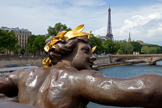 View on Seine River and Eiffel Tower from Alexander III bridge (pont Alexandre III) in Paris, France.