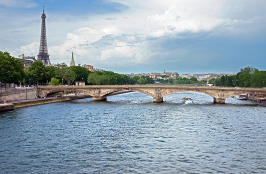 A view of the Eiffel Tower with a bridge in the foreground. Paris, France.