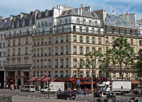 PARIS, FRANCE - JUNE 11, 2014: View of the french architecture near Eiffel tower.

Paris, France - June 11, 2014: View of the french architecture near Eiffel tower. People are walking by street.
