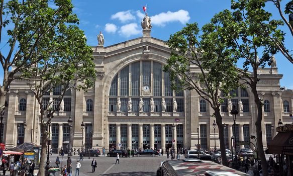 PARIS, FRANCE - JUNE 11, 2014: Gare du Nord (North Station, designed by Jacques Hittorff, 1864) - one of the six large SNCF terminal in Paris, largest and oldest railway stations in Paris. 

Paris, France - June 11, 2014: Gare du Nord (North Station, designed by Jacques Hittorff, 1864) - one of the six large SNCF terminal in Paris, largest and oldest railway stations in Paris. People are walking near the station.