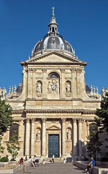 PARIS, FRANCE - JUNE 11, 2014: Sorbonne University in Latin Quarters, Paris. Name is derived from College de Sorbonne, founded by Robert de Sorbon (1257) - one of first colleges of medieval University.

Paris, France - June 11, 2014: Sorbonne University in Latin Quarters, Paris. Name is derived from College de Sorbonne, founded by Robert de Sorbon (1257) - one of first colleges of medieval University. People are resting near building.
