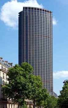 PARIS - JUNE 11: Tour Montparnasse (constructed 1969 - 1972) 210m, 59 floors office skyscraper on June 11, 2014 in Paris, France. Architects: Eugene Beaudouin, Urbain Cassan and Louis Hoym de Marien.

Paris, France - June 11, 2014: Tour Montparnasse (constructed 1969 - 1972) 210m, 59 floors office skyscraper. Architects: Eugene Beaudouin, Urbain Cassan and Louis Hoym de Marien.