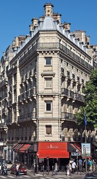 PARIS, FRANCE - JUNE 11, 2014: View of the parisian architecture on the Left Bank.

Paris, France - June 11, 2014: View of the parisian architecture on the Left Bank. People are walking by street.
