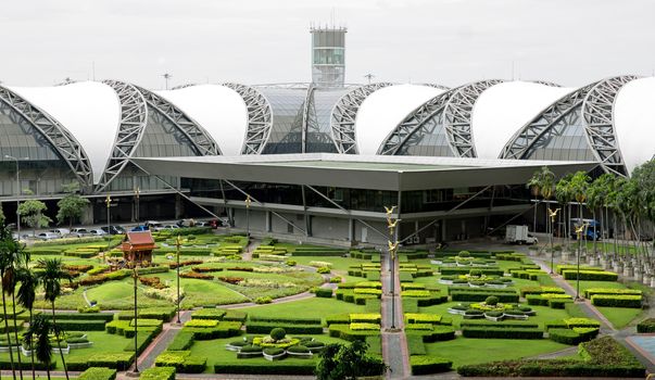 BANGKOK, THAILAND - JULY 21: Suvarnabhumi Airport is the world's third largest single-building airport terminal on July 21, 2013 in Bangkok, Thailand. Designed by Helmut Jahn.

Bangkok, Thailand - July 21, 2013: Suvarnabhumi Airport is the world's third largest single-building airport terminal. Designed by Helmut Jahn.