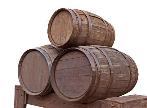 Three wooden barrels for wine with steel ring isolated on white. Clipping path included.