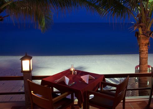 Tropical restaurant on the beach near the ocean