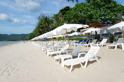 White Sandy Beach with Loungers and Umbrellas in Koh Samui, Thailand