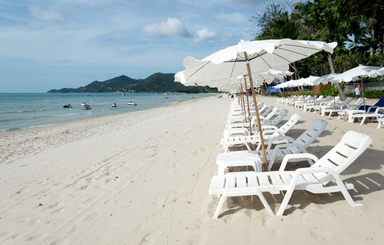 White Sandy Beach with Loungers and Umbrellas in Koh Samui, Thailand
