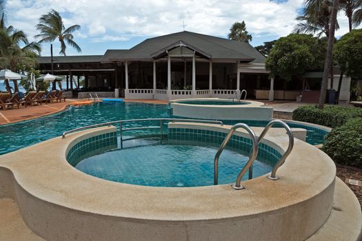 Luxury swimming pool in the tropical hotel.