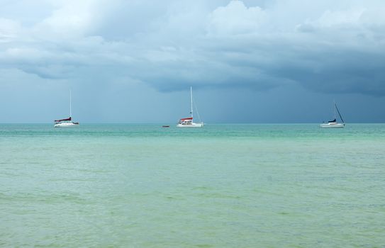 Three yachts on the Mediterranean Sea before storm