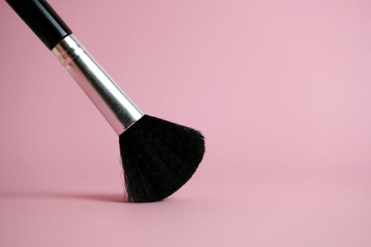 brush makeup tools with pink pastel background. Image photo