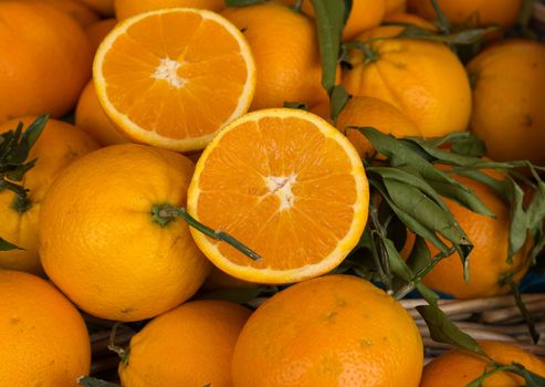 Many fresh oranges on the street market.