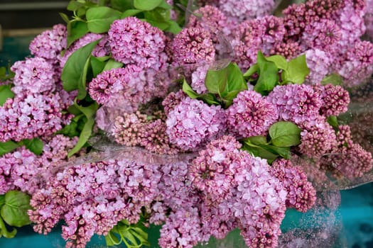 Bunches of lilac flowers on the street market