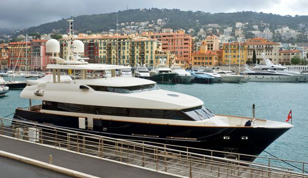 NICE, FRANCE - APRIL 27: Expensive yacht anchored within a Port de Nice on April 27, 2013 in Nice, France. Port de Nice was started in 1745.

Nice, France - April 27, 2013 : Expensive yacht anchored within a Port de Nice in French Riviera. Port de Nice was started in 1745.