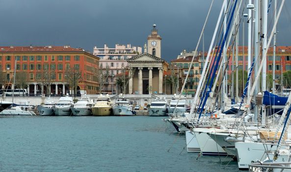 NICE, FRANCE - APRIL 27: Colorful buildings and boats within a Port de Nice on April 27, 2013 in Nice, France. Port de Nice was started in 1745.

Nice, France - April 27, 2013: Colorful buildings and boats within a Port de Nice in French Riviera. Port de Nice was started in 1745.