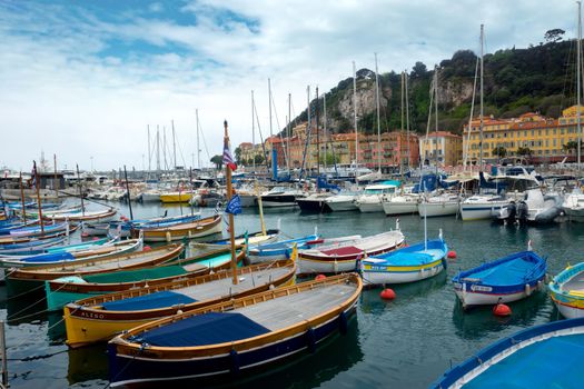 NICE, FRANCE - APRIL 27: Colorful buildings and boats within a Port de Nice on April 27, 2013 in Nice, France. Port de Nice was started in 1745.

Nice, France - April 27, 2013 : Colorful buildings and boats within a Port de Nice in French Riviera. Port de Nice was started in 1745.
Colorful buildings and boats within a harbor in beautiful Villefranche, France