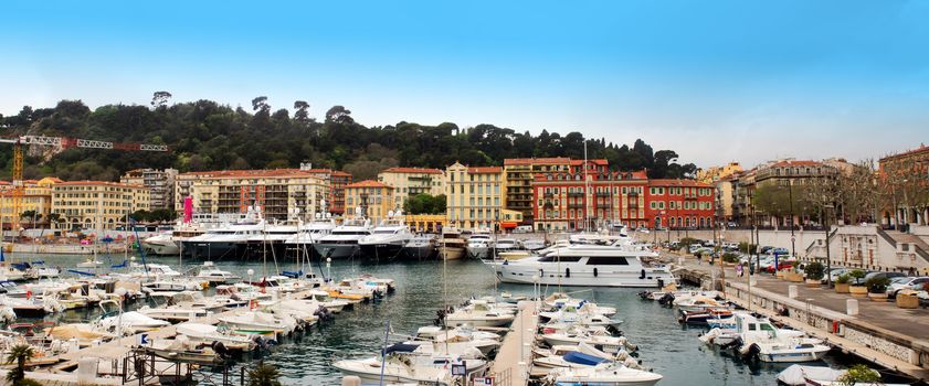 NICE, FRANCE - APRIL 27: Colorful buildings and boats within a Port de Nice on April 27, 2013 in Nice, France. Port de Nice was started in 1745.

Nice, France - April 27, 2013 : Colorful buildings and boats within a Port de Nice in French Riviera. Port de Nice was started in 1745.
Colorful buildings and boats within a harbor in beautiful Villefranche, France