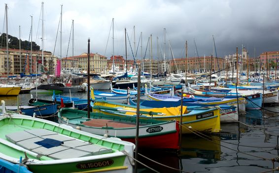NICE, FRANCE - APRIL 27: Colorful boats in the Port de Nice on April 27, 2013 in Nice, France. Port de Nice was started in 1745.

Nice, France - April 27, 2013: Colorful boats in the Port de Nice in French Riviera. Port de Nice was started in 1745.
