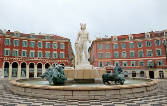NICE, FRANCE - APRIL 27: Panoramic view to Place Massena and fountain Soleil on April 27, 2013 in Nice, France. The square was reconstructed in 1979.

Nice, France - April 27, 2013: Panoramic view to Place Massena and fountain Soleil. Square is located in the city center and is the most popular destination among tourists. There are many boutiques, cafes and restaurants.