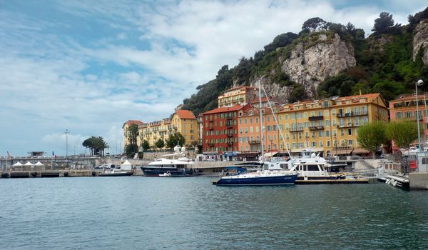 NICE, FRANCE - APRIL 27: Colorful buildings and boats within a Port de Nice on April 27, 2013 in Nice, France. Port de Nice was started in 1745.

Nice, France - April 27, 2013 : Colorful buildings and boats within a Port de Nice in French Riviera. Port de Nice was started in 1745.
Colorful buildings and boats within a harbor in beautiful Villefranche, France