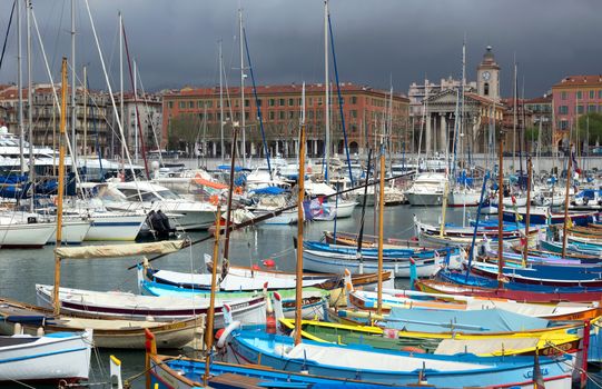 NICE, FRANCE - APRIL 27: Colorful boats in the Port de Nice on April 27, 2013 in Nice, France. Port de Nice was started in 1745.

Nice, France - April 27, 2013: Colorful boats in the Port de Nice in French Riviera. Port de Nice was started in 1745.