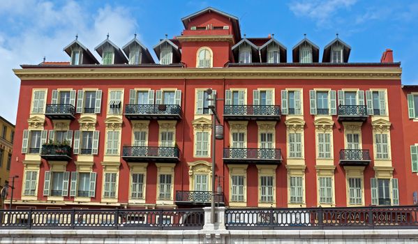 NICE, FRANCE - APRIL 27: Architecture along Promenade des Anglais on April 27, 2013 in Nice, France. It is a symbol of the Cote d'Azur and was built in 1830 at the expense of the British colony.

Nice, France - April 27, 2013: Architecture along Promenade des Anglais. People are walking. Promenade des Anglais is a symbol of the Cote d'Azur and was built in 1830 at the expense of the British colony.