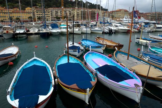 NICE, FRANCE - APRIL 27: Colorful buildings and boats within a Port de Nice on April 27, 2013 in Nice, France. Port de Nice was started in 1745.

Nice, France - April 27, 2013: Colorful buildings and boats within a Port de Nice in French Riviera. Port de Nice was started in 1745.