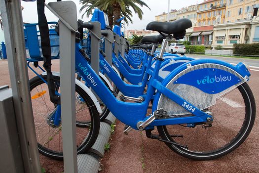 NICE, FRANCE - APRIL 27: Public Bicycles Sharing Station on April 27, 2013 in Nice, France. One of 120 stations in Nice. This service offers over 1200 self-service bicycles.

Public Bicycles Sharing Station in Nice, France

Nice, France - April 27, 2013: Row of public bikes for rent along the street. Nice has 120 stations. This service offers over 1200 self-service bicycles.
