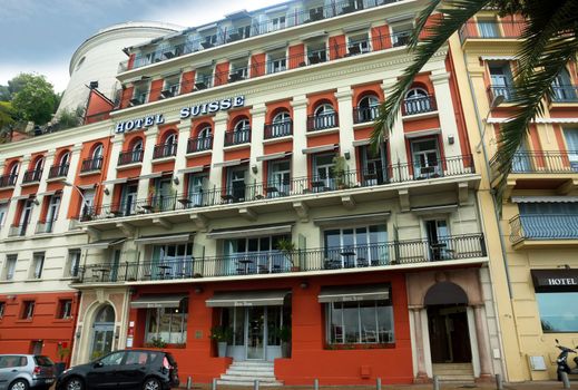 NICE, FRANCE - APRIL 27: Luxury Hotel Suisse on April 27, 2013 in Nice, France. Hotel Suisse set on the seafront in the historic district of Nice with exceptional views over the Baie des Anges and the Promenade des Anglais.

Nice, France - April 27, 2013: Luxury Hotel Suisse on English Promenade in Nice, French Riviera. Hotel Suisse set on the seafront in the historic district of Nice with exceptional views over the Baie des Anges and the Promenade des Anglais.