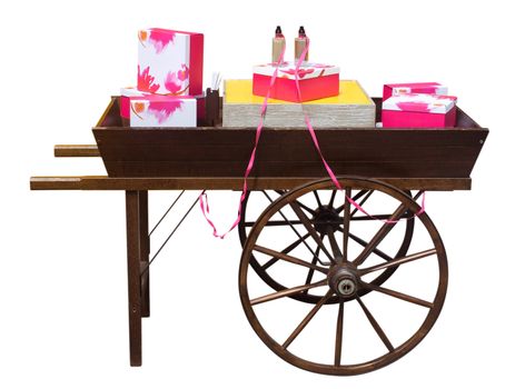 Wooden cart with gifts of perfume isolated on white. Clipping path included.