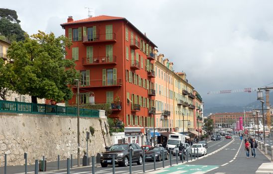 NICE, FRANCE - APRIL 27: Architecture along Promenade des Anglais on April 27, 2013 in Nice, France. It is a symbol of the Cote d'Azur and was built in 1830 at the expense of the British colony.

Nice, France - April 27, 2013: Architecture along Promenade des Anglais. People are walking. Promenade des Anglais is a symbol of the Cote d'Azur and was built in 1830 at the expense of the British colony.
