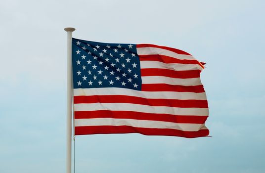United States Flag against a sky background 