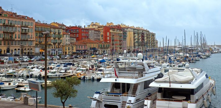 NICE, FRANCE - APRIL 27: View of Port de Nice on April 27, 2013 in Nice, France. Port de Nice was started in 1745.

Nice, France - April 27, 2013 : View of Port de Nice in French Riviera. Port de Nice was started in 1745.