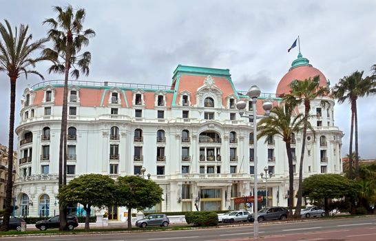 NICE, FRANCE - APRIL 27: Luxury Hotel Negresco on April 27, 2013 in Nice, France. Hotel Negresco is the famous luxury hotel on the Promenade des Anglais in Nice, a symbol of the Cote d'Azur.

Nice, France - April 27, 2013: Luxury Hotel Negresco on English Promenade in Nice, French Riviera. Hotel Negresco is the famous luxury hotel on the Promenade des Anglais in Nice, a symbol of the Cote d'Azur.