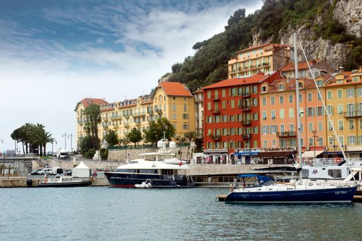 NICE, FRANCE - APRIL 27: Colorful buildings and boats within a Port de Nice on April 27, 2013 in Nice, France. Port de Nice was started in 1745.

Nice, France - April 27, 2013 : Colorful buildings and boats within a Port de Nice in French Riviera. Port de Nice was started in 1745.
Colorful buildings and boats within a harbor in beautiful Villefranche, France