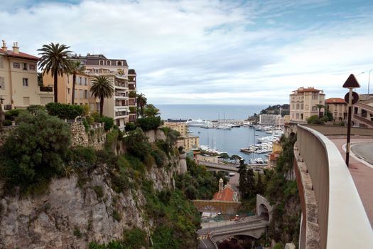 MONTE CARLO, MONACO - APRIL 28: View of the harbor from the train station Monaco-Ville on April 28, 2013 in Monte Carlo, Monaco. 

Monte Carlo, Monaco - April 28, 2013: View of the harbor from the train station Monaco-Ville