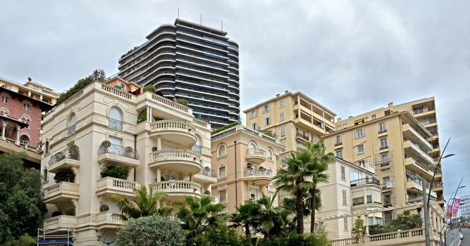 MONTE CARLO, MONACO - APRIL 28: The architecture of buildings near Casino on April 28, 2013 in Monte Carlo, Monaco. 

Monte Carlo, Monaco - April 28, 2013: The architecture of buildings near Casino. 
