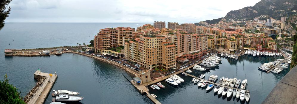 MONTE CARLO, MONACO - APRIL 28: Architecture Fontvieille district on April 28, 2013 in Monte Carlo, Monaco. Lands for the district have been reclaimed from the sea.

Monte Carlo, Monaco - April 28, 2013: Architecture Fontvieille district.  Lands for the district have been reclaimed from the sea.
