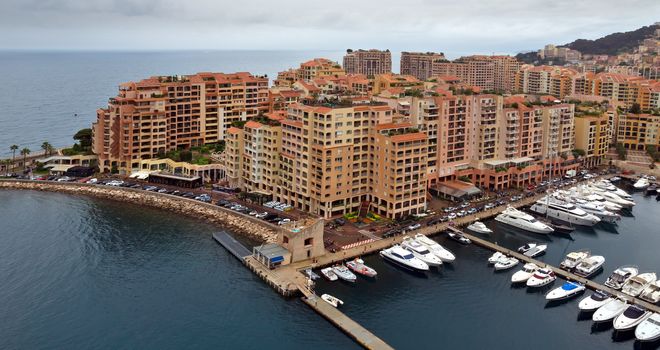 MONTE CARLO, MONACO - APRIL 28: Architecture Fontvieille district on April 28, 2013 in Monte Carlo, Monaco. Lands for the district have been reclaimed from the sea.

Monte Carlo, Monaco - April 28, 2013: Architecture Fontvieille district.  Lands for the district have been reclaimed from the sea.