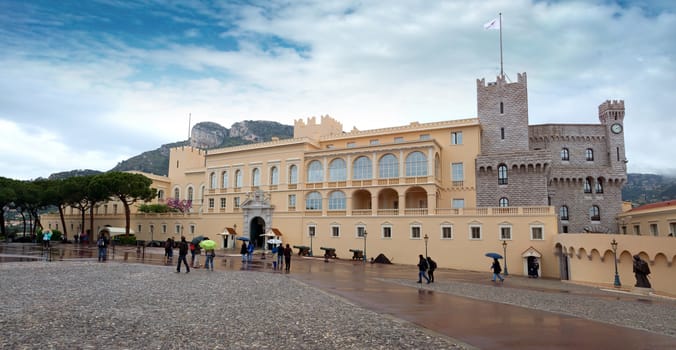 MONTE CARLO, MONACO - APRIL 28: Panoramic view of Prince's Palace is official residence of Prince of Monaco on April 28, 2013 in Monte Carlo, Monaco.

Monte Carlo, Monaco - April 28, 2013: Panoramic view of Prince's Palace is official residence of Prince. Tourists are walking and exploring the monuments of architecture.