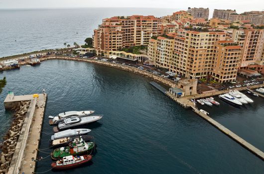 MONTE CARLO, MONACO - APRIL 28: Architecture Fontvieille district on April 28, 2013 in Monte Carlo, Monaco. Lands for the district have been reclaimed from the sea.

Monte Carlo, Monaco - April 28, 2013: Architecture Fontvieille district.  Lands for the district have been reclaimed from the sea.