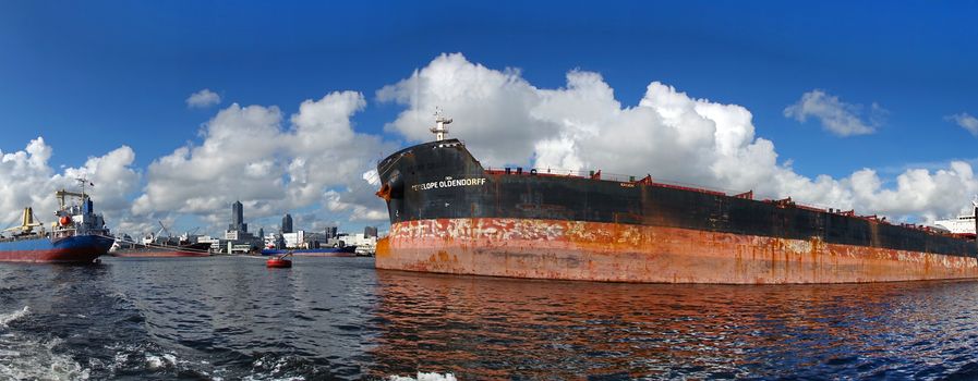 KAOHSIUNG, TAIWAN -- JUNE 2, 2019: Two large cargo ships are docked in Kaohsiung Port