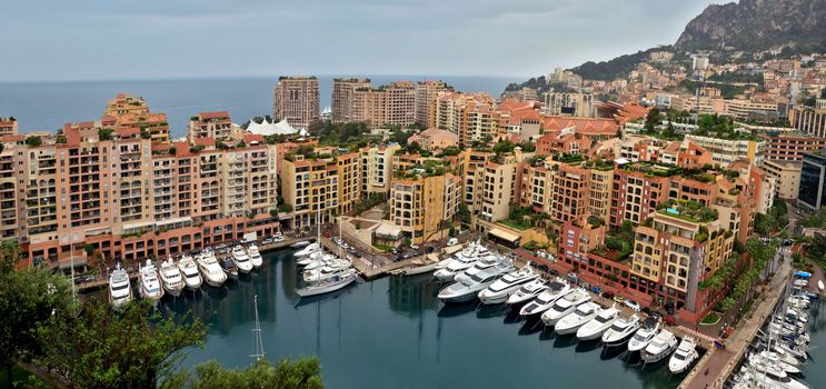 MONTE CARLO, MONACO - APRIL 28: Architecture Fontvieille district on April 28, 2013 in Monte Carlo, Monaco. Lands for the district have been reclaimed from the sea.

Monte Carlo, Monaco - April 28, 2013: Architecture Fontvieille district.  Lands for the district have been reclaimed from the sea.