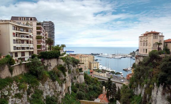MONTE CARLO, MONACO - APRIL 28: View of the harbor from the train station Monaco-Ville on April 28, 2013 in Monte Carlo, Monaco. 

Monte Carlo, Monaco - April 28, 2013: View of the harbor from the train station Monaco-Ville