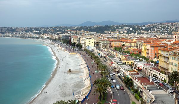NICE, FRANCE - APRIL 29: Architecture along Promenade des Anglais on April 29, 2013 in Nice, France. It is a symbol of the Cote d'Azur and was built in 1830 at the expense of the British colony.

Nice, France - April 29, 2013: Architecture along Promenade des Anglais. People are resting. Promenade des Anglais is a symbol of the Cote d'Azur and was built in 1830 at the expense of the British colony.