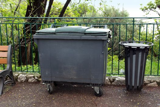 Trash container and basket at the park