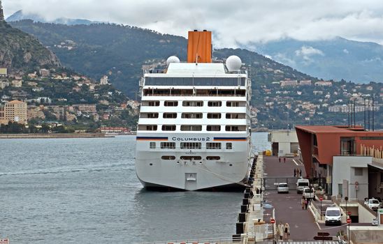 MONTE CARLO, MONACO - APRIL 28: Cruise ship the Columbus-2 docked in Monte Carlo on the Mediterranean Sea on April 28, 2013 in Monte Carlo, Monaco. Monte Carlo is a popular destination in the world.

Monte Carlo, Monaco - April 28, 2013: Cruise ship the Columbus-2 docked in Monte Carlo on the Mediterranean Sea. Monte Carlo is a popular destination in the world. People are walking along pier.