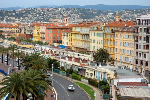 NICE, FRANCE - APRIL 29: Architecture along Promenade des Anglais on April 29, 2013 in Nice, France. It is a symbol of the Cote d'Azur and was built in 1830 at the expense of the British colony.

Nice, France - April 29, 2013: Architecture along Promenade des Anglais. People are resting. Promenade des Anglais is a symbol of the Cote d'Azur and was built in 1830 at the expense of the British colony.