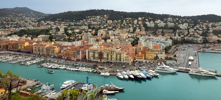 NICE, FRANCE - APRIL 29: Panoramic view of Port de Nice on April 29, 2013 in Nice, France. Port de Nice was started in 1745.

Nice, France - April 29, 2013: Panoramic view of Port de Nice in French Riviera. Port de Nice was started in 1745.